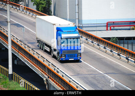 Transportation of cargoes in containers by lorry Stock Photo