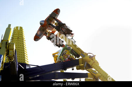 Brighton UK June 2015 - People enjoy the Air Race fairground ride on Brighton Pier formerly known as the Palace Pier Stock Photo