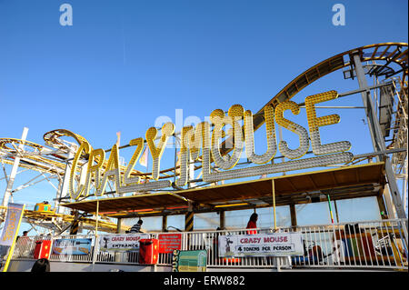 June 2015 - People enjoy the Crazy Mouse roller coaster fairground ride on Brighton Pier formerly known as the Palace Pier Stock Photo