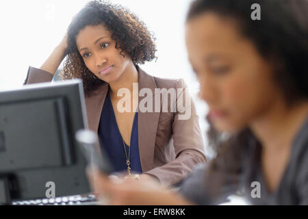 Businesswomen working in office Stock Photo