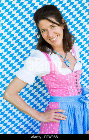 Portrait od a brunette woman in dirndl Stock Photo