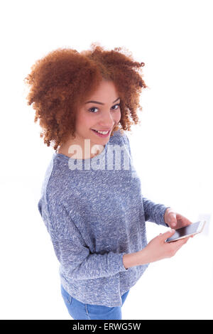 African American young woman sending a text message on her smartphone - Black teenager people Stock Photo
