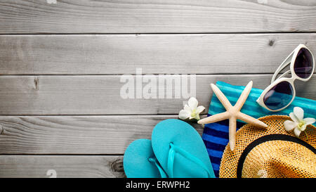 Beach accessories on wooden board Stock Photo