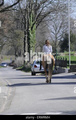 woman rides pony Stock Photo - Alamy