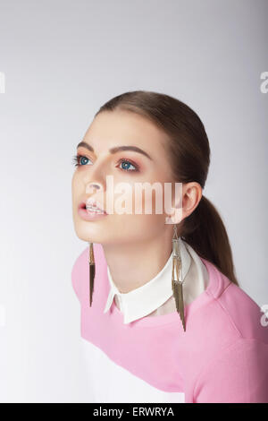 Attractive Young Female Looking Up Stock Photo