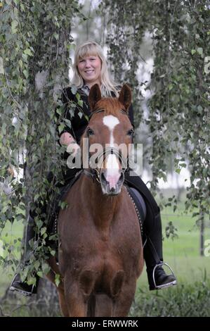 woman rides Pony Stock Photo - Alamy