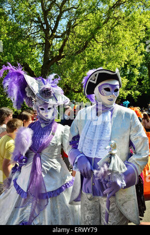 MOUSCRON, BELGIUM-JUNE 06, 2015: Participants of defile in costumes of Carnival de Venice in Parc Communal during 6 edition of V Stock Photo