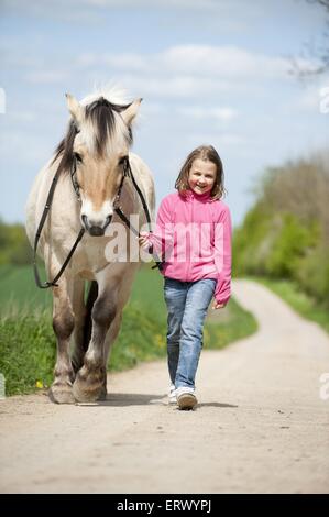 girl with Fjord horse Stock Photo