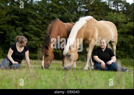 women with horses Stock Photo