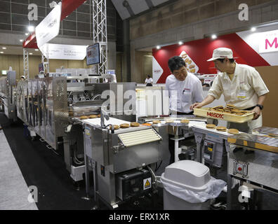 Tokyo. 9th June, 2015. Photo taken on June 9, 2015 shows a dorayaki machine demonstrated at the International Food Machinery and Technology Exhibition in Tokyo, Japan. The four-day exbihition kicked off in Japan on Tuesday with the participation of 681 companies. Credit:  Stringer/Xinhua/Alamy Live News Stock Photo