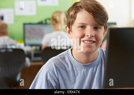 Male Elementary School Pupil In Computer Class Stock Photo