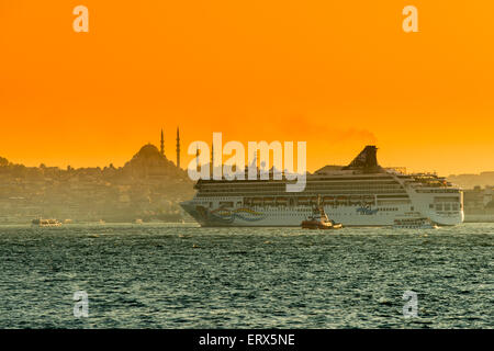 Norwegian Spirit cruise ship departing under the sunset golden light, Istanbul, Turkey Stock Photo