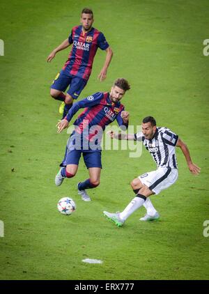 Turin's Carlos Tevez and Barcelona's Gerard Pique during the UEFA Champions League final soccer match between Juventus FC and FC Barcelona at Olympic Stadium in Berlin, Germany, 06 June 2015. Photo: Thomas Eisenhuth/dpa Stock Photo