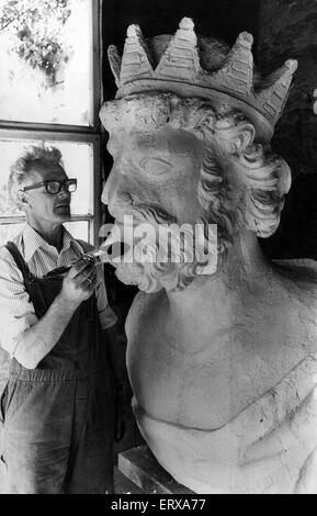 Caldicot Castle, Monmouth, southeast Wales, 11th June 1974. Pictured, Castle caretaker, John Dickenson, cleans figurehead which used to belong on Nelson's onetime flagship, The Foudroyant. The original Foudroyant.   was bought from the Navy by Wheatly Cobb, it was wrecked off Blackpool in 1897 and only the guns and figurehead were recovered. The figurehead was taken to Caldicot by Mr Cobb and has remained there every since. Stock Photo