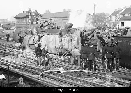 The Harrow and Wealdstone rail crash was a three train collision at Harrow and Wealdstone station, in London, at 8:19 am on 8 October 1952. An express train from Perth, Scotland collided at speed into the rear of the Tring to Euston local service passenger train that had stopped at the station; within a few seconds of this collision the Euston to Liverpool express train, travelling at speed in the opposite direction, crashed into the Perth train's locomotive. It was the worst peacetime rail crash in the United Kingdom there were 112 fatalities. Our Picture Shows: One of the tree locomotives in Stock Photo