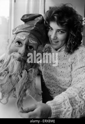 Wendy Morgan, staff member at the Welsh Folk Museum, pictured with 1909 father christmas head, Cardiff, Wales, 6th November 1987. Stock Photo