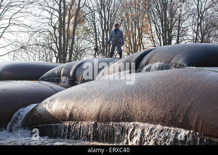 Germany, Iserlohn, sludge dewatering using geotextile tubes, Geotubes Stock Photo