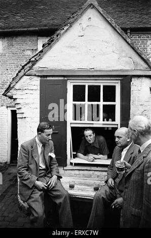 A group of men enjoy a game of Bat and Trap at a pub in Kent. Bat and ...