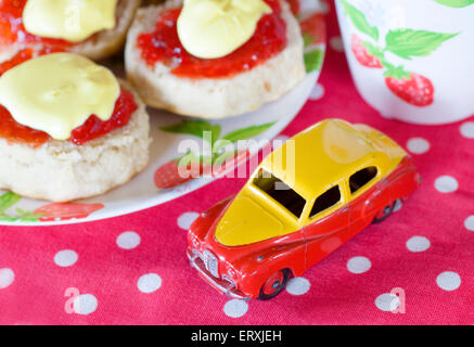 Dinky model toy Austin Somerset car in a cream tea table setting Stock Photo