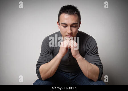 sad man lost in thought Stock Photo