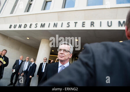 Berlin, Germany. 09th June, 2015. German Interior Minister Thomas de Maiziere (CDU) waits for the start of the official opening ceremony of the new building of the Ministry of the Interior in Berlin, Germany, 09 June 2015. Photo: GREGOR FISCHER/dpa/Alamy Live News Stock Photo