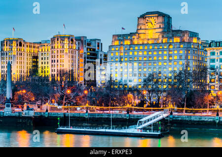 Buildings in the Victoria Embankment and Cleopatra's Needle, Pier By the River in London Stock Photo