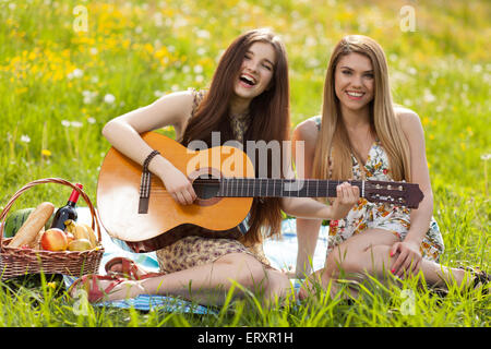 Two beautiful young women on a picnic Stock Photo