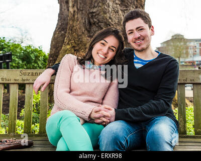 Couple hugging on park bench, Stock Photo, Picture And Royalty Free Image.  Pic. CIE-412-11674 | agefotostock