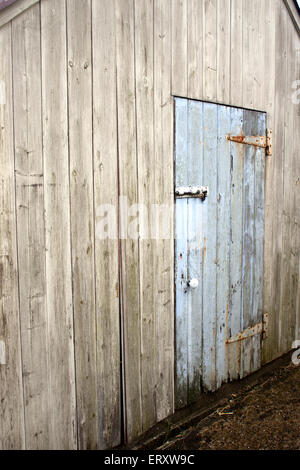 Light Blue Wooden Farm outbuilding Door Stock Photo