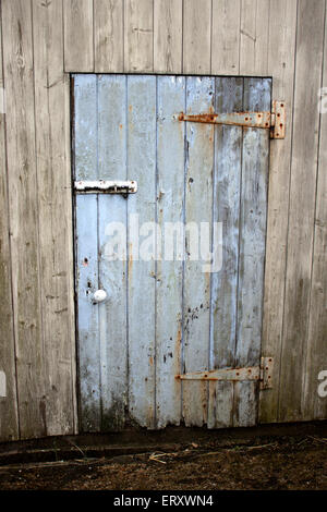 Light Blue Wooden Farm outbuilding Door Stock Photo