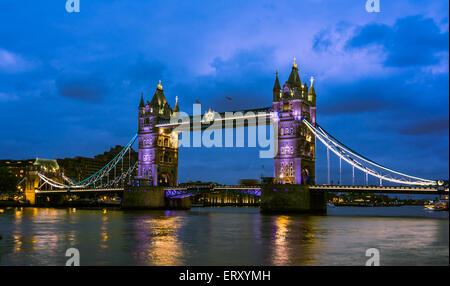 Bridge Tower night view from the bridge, London United Kingdom. A combined bascule and suspension bridge which crosses the River Stock Photo