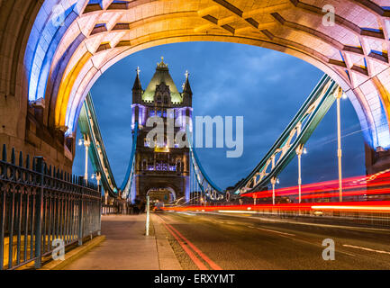 Bridge Tower night view from the bridge, London United Kingdom. A combined bascule and suspension bridge which crosses the River Stock Photo