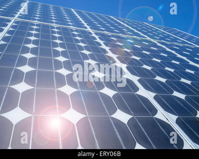 Blue solar panels photovoltaic cells array close up abstract background  Renewable energy clean eco friendly power source global warming concept Stock Photo