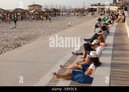 people sitting along Tel Aviv seafront , Israel Stock Photo