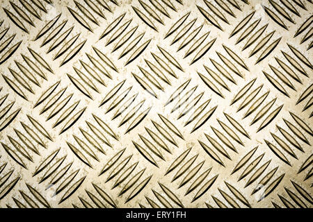 Gold colored diamond plate, checker plate, tread plate, cross hatch kick plate and Durbar floor plate for texture background. Stock Photo
