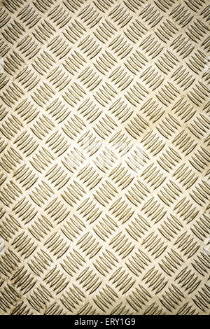 Gold colored diamond plate, checker plate, tread plate, cross hatch kick plate and Durbar floor plate for texture background. Stock Photo