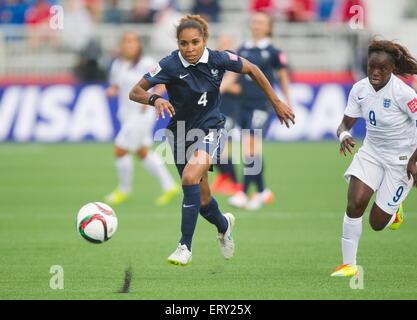 Moncton, Canada. 9th June, 2015. Eniola Aluko(R) of England vies with Laura Georges of France during their group F match at the 2015 FIFA Women's World Cup in Moncton, Canada, June 9, 2015. France won 1-0. Credit:  Zou Zheng/Xinhua/Alamy Live News Stock Photo