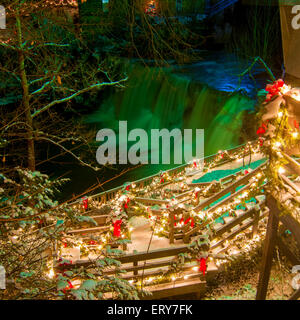 The falls in Chagrin Falls, Ohio, and its viewing platform are lit up for Christmas Stock Photo