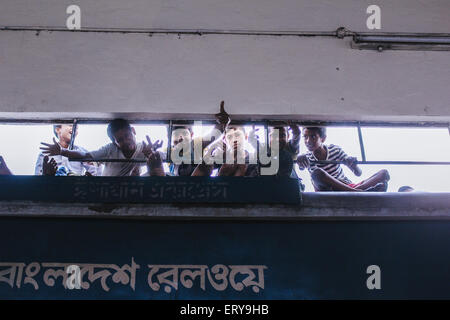Dhaka, Bangladesh. 09th June, 2015. Here the public trains are generally loaded with too many people.The compartments are overly populated.People also travel by sitting on the roof-top of the train and they even travel by sitting in the train-engine. © Belal Hossain Rana/Pacific Press/Alamy Live News Stock Photo