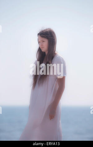 a girl in a white dress Stock Photo