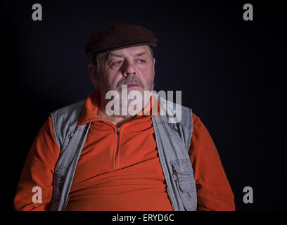 Nice portrait of a thoughtful senior man (low key) Stock Photo