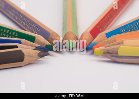 Set of crayons pointing to the center on white background Stock Photo