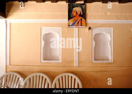 Peshwa house interior , three chairs , two alcoves , one Shivaji Maharaj print , Junnar ; Pune ; Maharashtra ; India , Asia Stock Photo