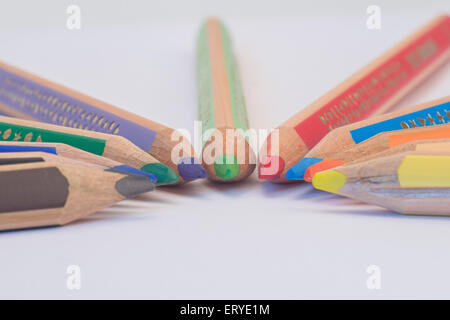 Set of crayons pointing to the center on white background Stock Photo