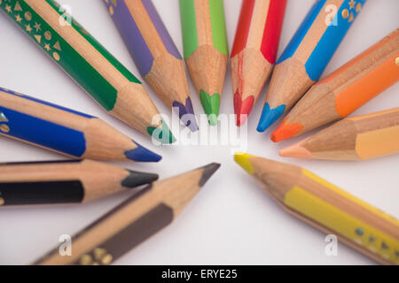 Set of crayons pointing to the center on white background Stock Photo