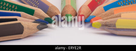 Set of crayons pointing to the center on white background Stock Photo