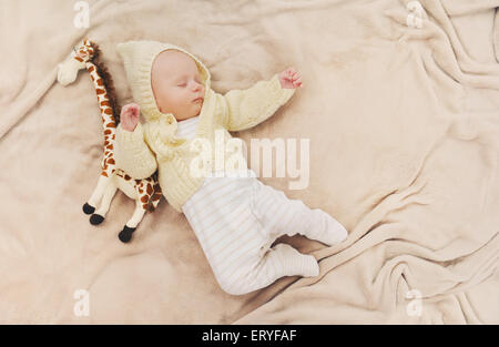 sleeping cute newborn baby, maternity concept, soft image of beautiful family Stock Photo