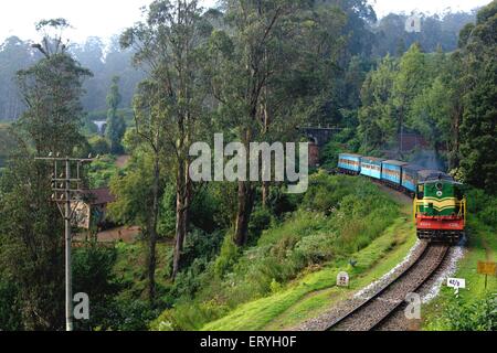 Nilgiri Mountain Railway or Toy Train from Mettupalayam to Ooty via Coonoor Tamil Nadu India Indian toy train Stock Photo