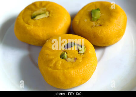 kesar mawa peda garnish with pistachio , saffron khoya peda , khoa pera , Stock Photo