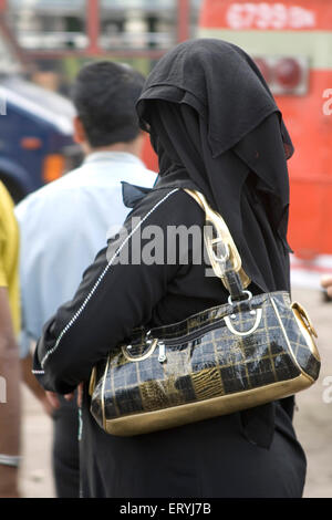 Muslim woman in black burqa India - akm 154886 Stock Photo